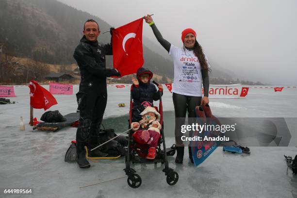 Turkish free diver Derya Can Gocen poses for a photo with her husband Tayfun Gocen , her 14 months old daughter Derin Helen and her 6 years old son...