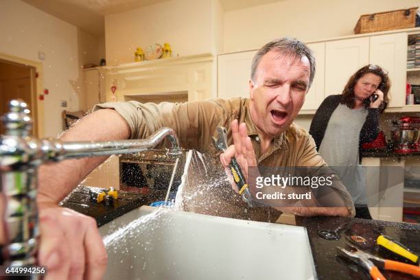 amateur plumber - diy disaster stock pictures, royalty-free photos & images