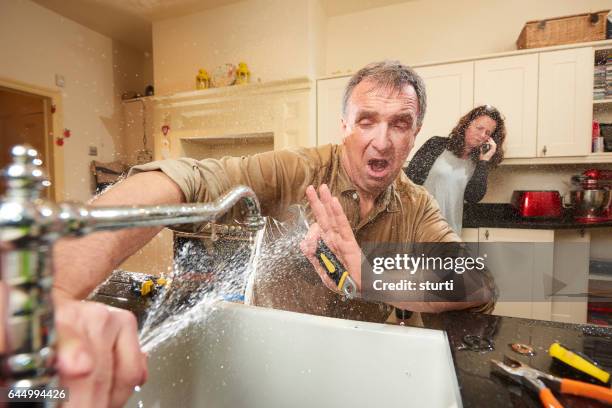 call a plumber - diy disaster stock pictures, royalty-free photos & images