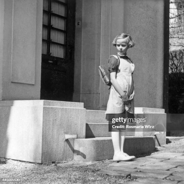 girl on her first day of school, switzerland 1951. - 1951 stock pictures, royalty-free photos & images