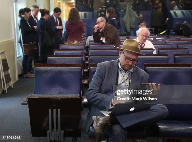 New York Times reporter Glenn Thrush works in the Brady Briefing Room after being excluded from a press gaggle by White House Press Secretary Sean...
