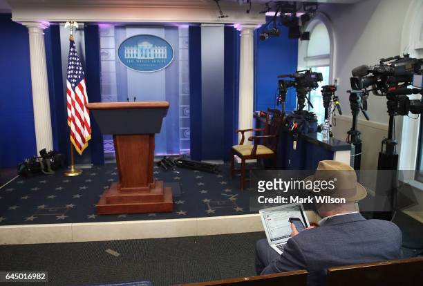 New York Times reporter, Glenn Thrush works in the Brady Briefing Room after being excluded from a press gaggle by White House Press Secretary Sean...