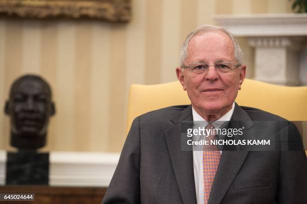Peruvian President Pedro Pablo Kuczynski looks on during a meeting with US President Donald Trump in the Oval Office at the White House in Washington...