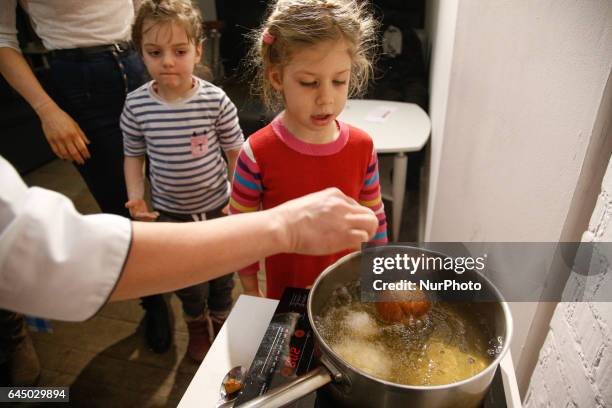 People are seen participating in a baking class making paczki, a Polish doughnut like pastry on 23 February, 2017. Every year on the last Thursday...