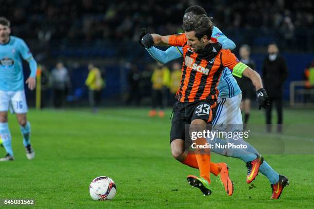 Dario Srna fighting with opponent for the ball during the Europa League Round of 32 reverse match between Shakhtar and Celta at Metalist Stadium on...