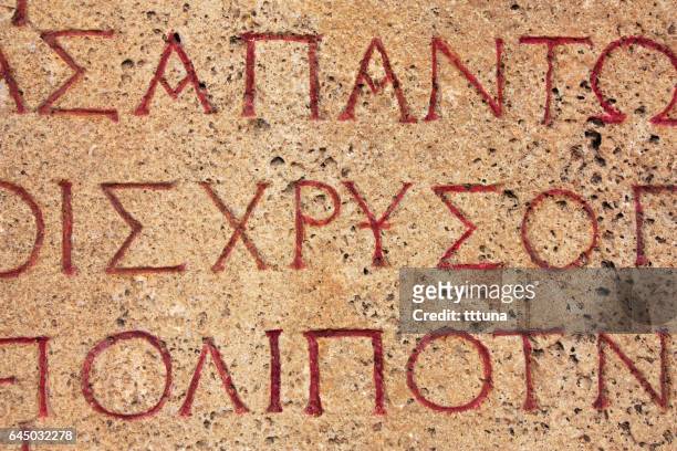 griechische schrift in hierapolis amphitheater - ancient greek alphabet stock-fotos und bilder