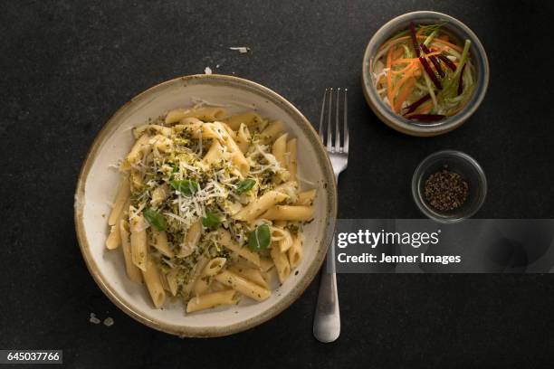 penne pasta in a broccoli creamy sauce. - primavera stockfoto's en -beelden