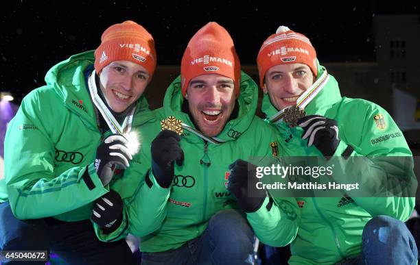 Silver medalist Eric Frenzel of Germany, gold medalist Johannes Rydzek of Germany and bronze medalist Bjoern Kircheisen of Germany pose with their...