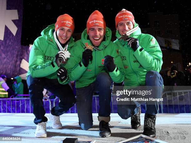 Silver medalist Eric Frenzel of Germany, gold medalist Johannes Rydzek of Germany and bronze medalist Bjoern Kircheisen of Germany pose with their...