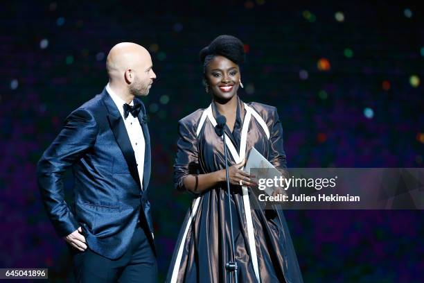 Franck Gastambide and Aissa Maiga speak on stage during the Cesar Film Awards Ceremony at Salle Pleyel on February 24, 2017 in Paris, France.