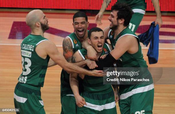 Mike James, #5 of Panathinaikos Superfoods Athens scores a buzzer beater that gives his team the victory and celebrates with his teamates, during the...