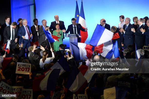 French candidate for the right-wing 'Les Republicains' Party Francois Fillon salutes the crowd as he arrives on stage for a political meeting on...