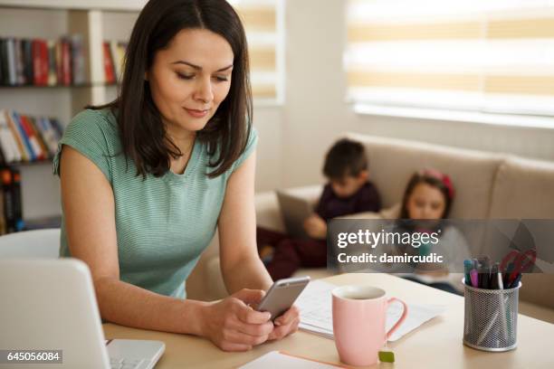 mother working from home - parents stock pictures, royalty-free photos & images