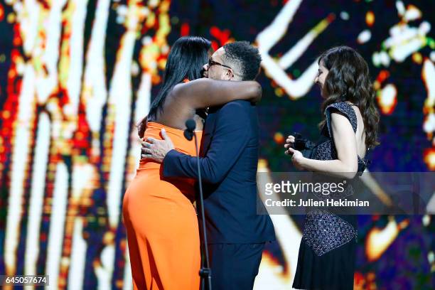 Deborah Lukumuena receives the Cesar of Best supporting actress in 'Divines' from Joey Starr and Anna Mouglalis during the Cesar Film Awards Ceremony...