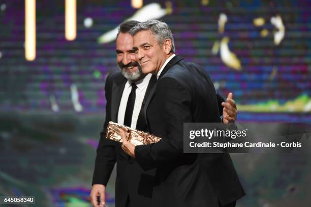 Jean Dujardin and George Clooney during the Cesar Film Awards 2017 ceremony at Salle Pleyel on February 24, 2017 in Paris, France.