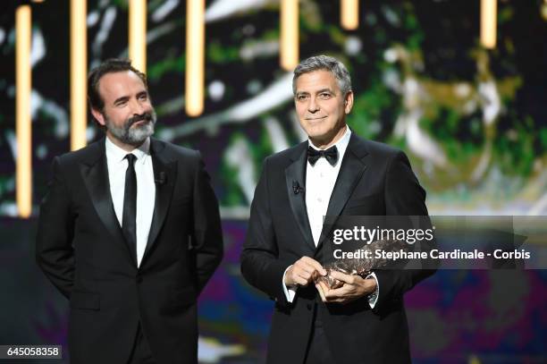 Jean Dujardin and George Clooney during the Cesar Film Awards 2017 ceremony at Salle Pleyel on February 24, 2017 in Paris, France.