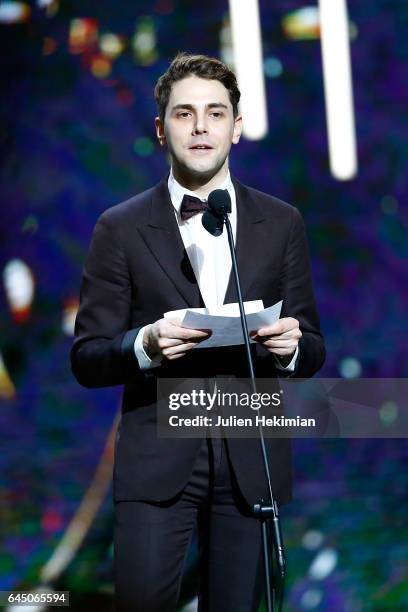Xavier Dolan speaks on stage after he receives the Cesar of Best Director for 'Juste la fin du monde' during the Cesar Film Awards Ceremony at Salle...