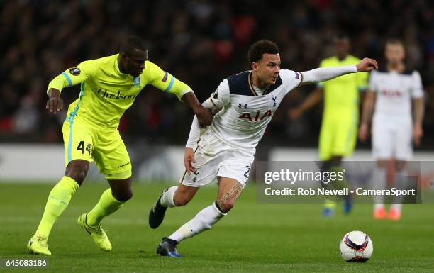 Tottenham Hotspur's Dele Alli and KAA Gent's Anderson Esitia during the UEFA Europa League Round of 32 second leg match between Tottenham Hotspur and...