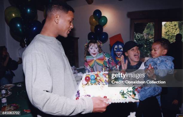 Will Smith and his wifeSheree Zampino hold their son Trey Smith at his second birthday party on November 14, 1992 in Los Angeles, California .