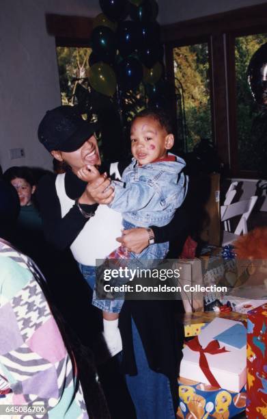 Sheree Zampino holds her son Trey Smith at his second birthday party on November 14, 1992 in Los Angeles, California .
