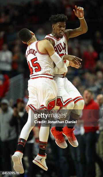 Jimmy Butler and Denzel Valentine of the Chicago Bulls celebrate after Butler hit a three point shot late in the fourth quarter against the Phoenix...