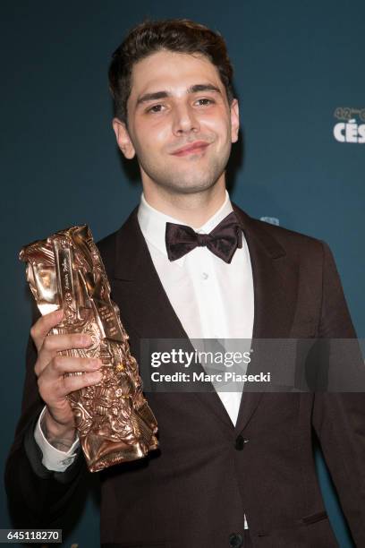 Director Xavier Dolan poses with his award at the Cesar Film Awards 2016 at Salle Pleyel on February 24, 2017 in Paris, France.