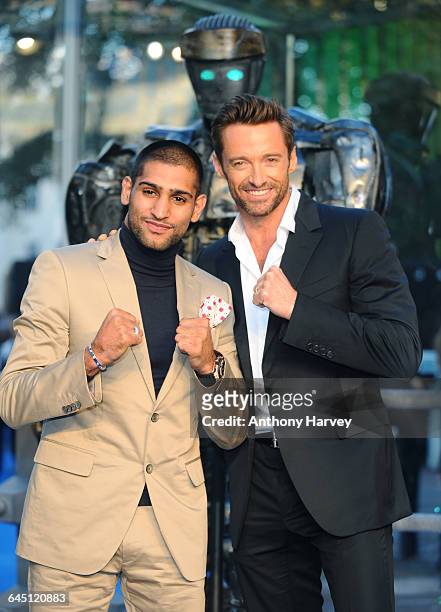 Boxer Amir Khan and Actor Hugh Jackman attend the Real Steel Premiere on September 14, 2011 at the Empire Cinema, Leicester Square in London.