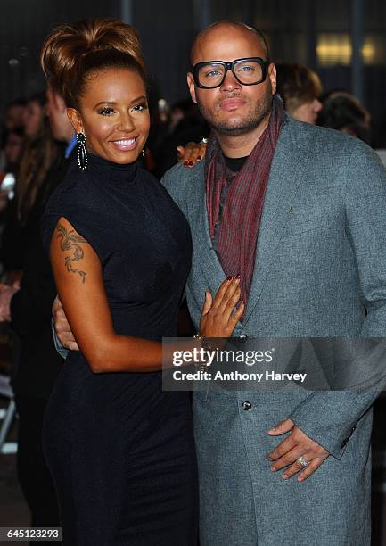 Mel B and Stephen Belfonte attend The Hunger Games Premiere on March 14, 2012 at the O2 Arena in London.