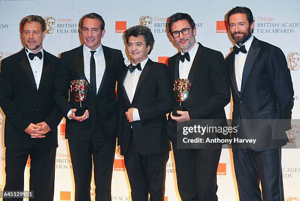 Actor Russell Crowe, Jean Dujardin , producer Thomas Langmann, director Michel Hazanavicius and Hugh Jackman pose in the press room with the Best...