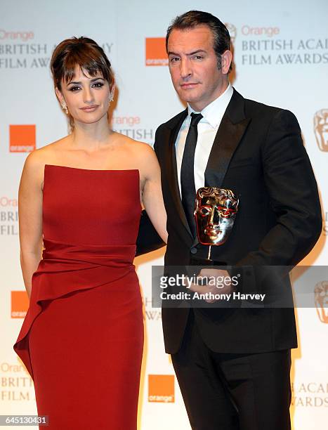 Penelope Cruz and Jean Dujardin pose in the press room with his Best Actor award during the 2012 Orange British Academy Film Awards on February 12,...