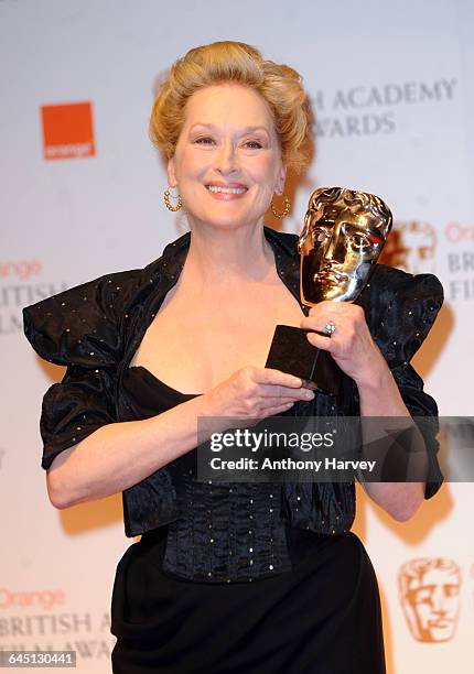 Meryl Streep poses in the press room with the Best Actress award for 'The Iron Lady' during the 2012 Orange British Academy Film Awards on February...