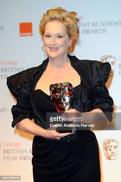 Meryl Streep poses in the press room with the Best Actress award for 'The Iron Lady' during the 2012 Orange British Academy Film Awards on February...