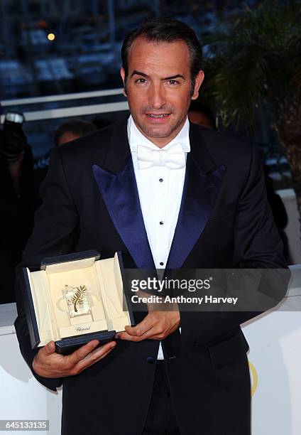 Actor Jean Dujardin poses at the Palme d'Or Winners Photocall at the Palais des Festivals during the 64th Cannes Film Festival on May 20, 2011 in...
