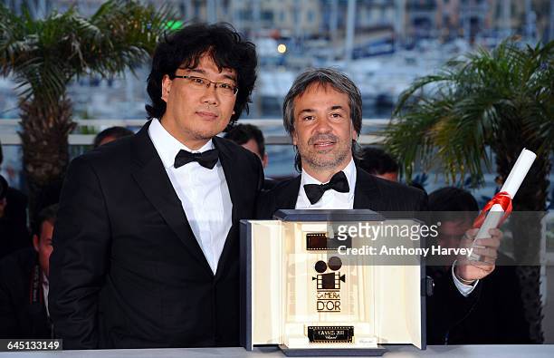 Joon Ho Bong and Pablo Giorgelli pose at the Palme d'Or Winners Photocall at the Palais des Festivals during the 64th Cannes Film Festival on May 20,...