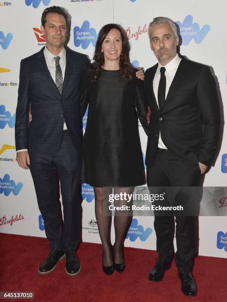 Emile Sherman, Angie Fielder, and Iain Canning attend the Screen Australia and Australians in Film reception for Australian Oscar nominees at Four...