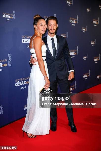 Natasha Andrews and Pierre Niney arrive at the Cesar Film Awards 2017 ceremony at Salle Pleyel on February 24, 2017 in Paris, France.