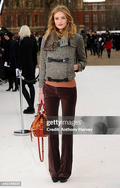 Rosie Huntington-Whiteley attends the Burberry Autumn Winter 2012 Womenswear Front Row during London Fashion Week at Kensington Gardens on February...