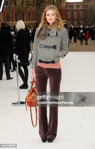 Rosie Huntington-Whiteley attends the Burberry Autumn Winter 2012 Womenswear Front Row during London Fashion Week at Kensington Gardens on February...