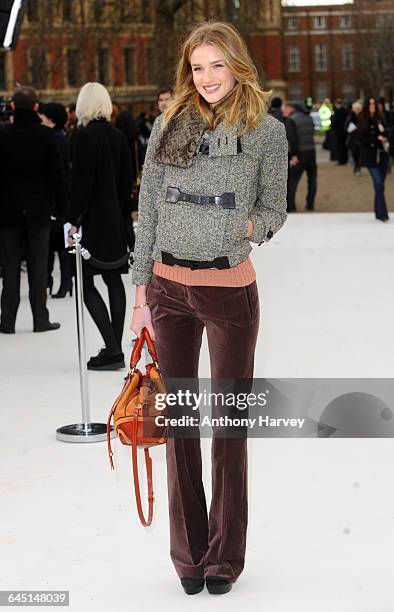 Rosie Huntington-Whiteley attends the Burberry Autumn Winter 2012 Womenswear Front Row during London Fashion Week at Kensington Gardens on February...