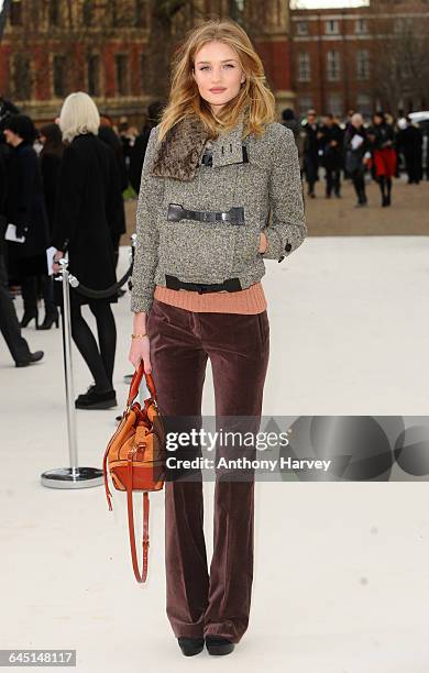 Rosie Huntington-Whiteley attends the Burberry Autumn Winter 2012 Womenswear Front Row during London Fashion Week at Kensington Gardens on February...