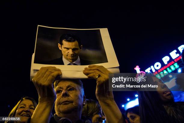 Woman holds a picture of I. Urdangarin during a protest against corruption case "Noos". I. Urdangarin has been sentenced with jail for six years and...