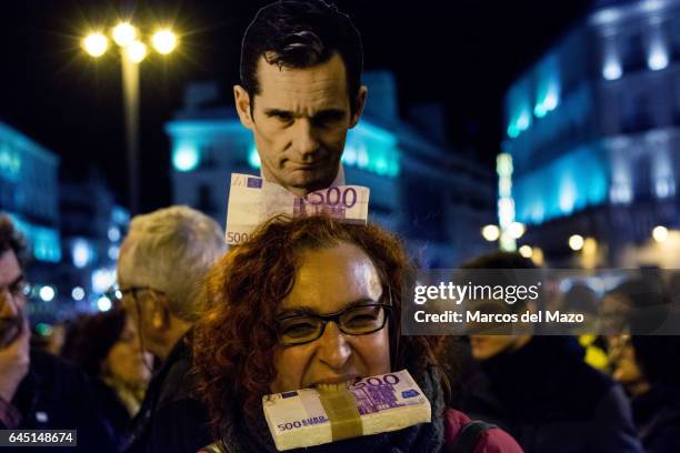 Woman with a picture of I. Urdangarin protesting against corruption case "Noos". I. Urdangarin has been sentenced with jail for six years and three...