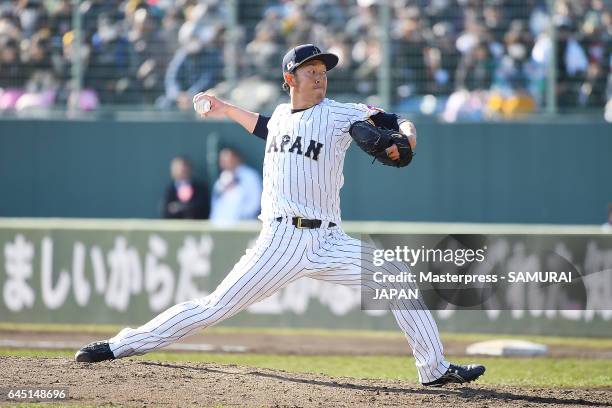 Yoshihisa Hirano of Samurai Japan pitches in the seventh inning during the SAMURAI JAPAN Friendly Opening Match between SAMURAI JAPAN and Fukuoka...