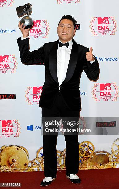 Singer Psy poses backstage with his award for Best Video in the photo room at the MTV EMA's 2012 at Festhalle Frankfurt on November 11, 2012 in...