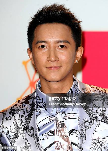 Singer Han Geng poses backstage in the photo room with his award for Best Worldwide Act at the MTV EMA's 2012 at Festhalle Frankfurt on November 11,...