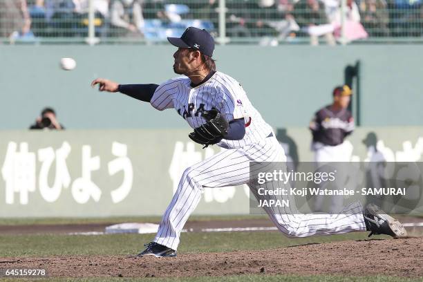 Ryo Akiyoshi of Samurai Japan pitches in the ninth inning during the SAMURAI JAPAN Friendly Opening Match between SAMURAI JAPAN and Fukuoka SoftBank...