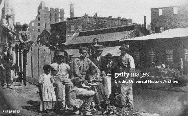 Freed slaves on the canal bank at Richmond, Virginia, 1865.