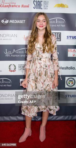 Isabel Gravitt poses on the red carpet at the finale of the 12th Los Angeles Italia Film Festival in Los Angeles, California on February 24, 2017. /...