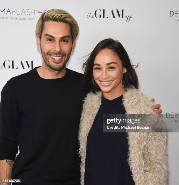 Joey Maloof and Ashley Madekwe attends The Glam App x DERMAFLASH Host Pre-Oscars Suite at Peninsula Hotel on February 24, 2017 in Beverly Hills,...