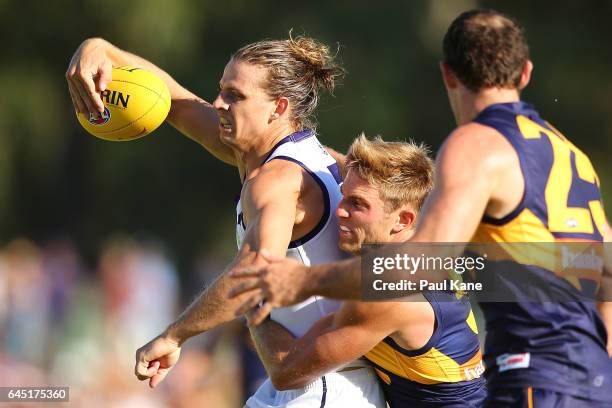 Nathan Fyfe of the Dockers gets tackled by Brad Sheppard of the Eagles during the JLT Community Series AFL match between the West Coast Eagles and...